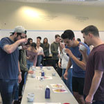 thumbnail of students smelling cups of coffee